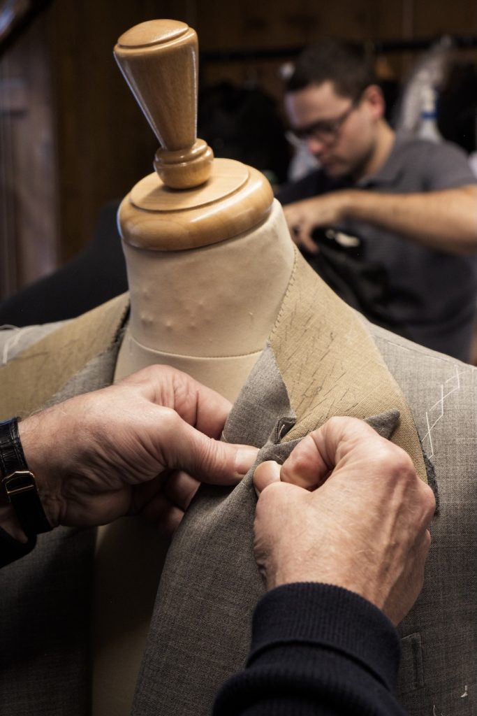 Tailor working on suit