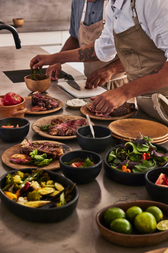 chefs preparing dish