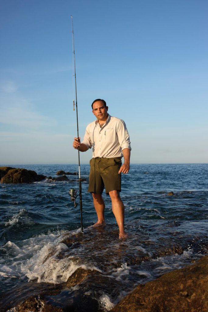 A man with a fishing rod in Los Cabos
