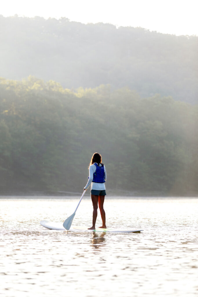 Woman paddleboarding at Primland Resort, Virginia
